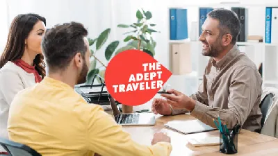 A travel advisor sitting with clients