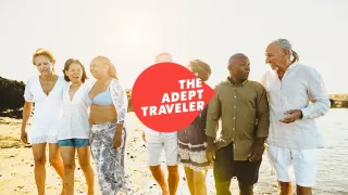 A group of friends walking along a beach