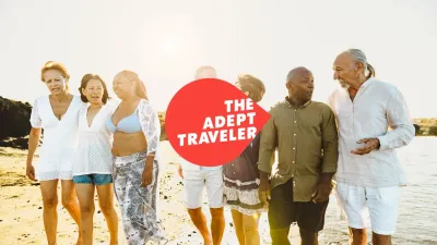 A group of friends walking along a beach