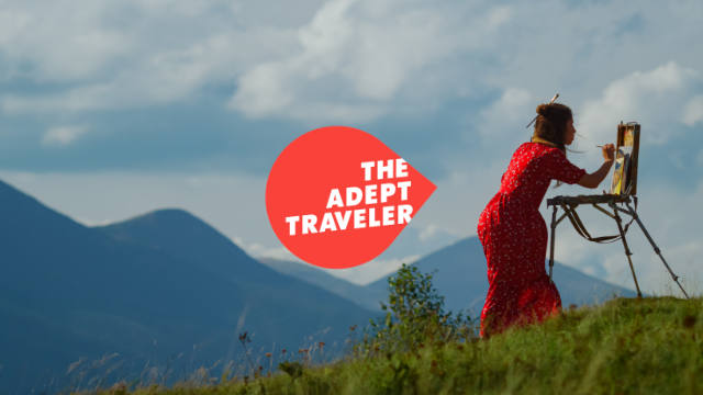 Woman painting in the mountains