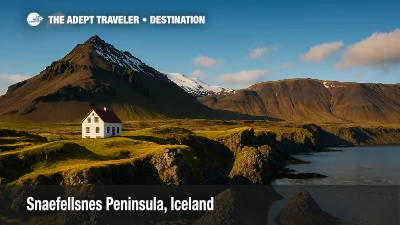 Snæfellsnes Peninsula in Iceland with Snæfellsjökull volcano, white house with red roof, basalt cliffs, and calm ocean at sunset.