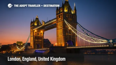 ower Bridge glowing at dusk, its lights reflecting on the Thames, viewed from a dramatic low angle.