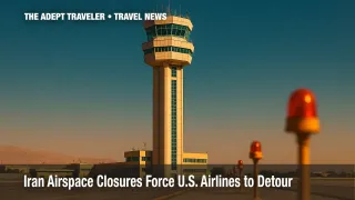Control tower dominating Tehran runway under clear sky, illustrating Iran airspace alert.