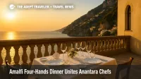 Dei Cappuccini terrace table prepared for exclusive Amalfi four-hands dinner overlooking sunlit Amalfi Coast cliffs and sea.