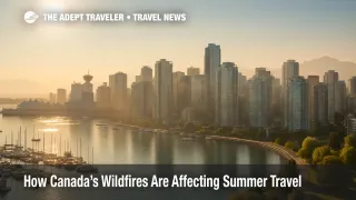 Light wildfire smoke veils Vancouver's harbor skyline, illustrating Canada wildfires travel impact on summer trips.