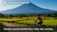 E-bike rider in Shizuoka countryside with Mount Fuji backdrop showcases new tours and 2025 climbing rules.