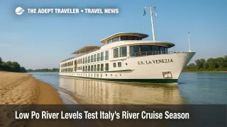 A river-cruise ship edges past a broad sandbank on the low-water Po River, illustrating Italy river-cruises adapting to shallow levels.