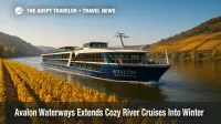 Avalon Waterways ship passes golden vineyards on the Rhine during a fall river cruise in Europe.
