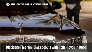 A Blacklane Platinum Class Rolls-Royce Ghost waits curbside at Dubai International Airport, showcasing the new luxury chauffeur service.
