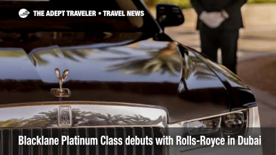 A Blacklane Platinum Class Rolls-Royce Ghost waits curbside at Dubai International Airport, showcasing the new luxury chauffeur service.