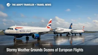 Grounded British Airways and Lufthansa jets glisten on a rain-wet Heathrow ramp after storm-driven European flight cancellations.