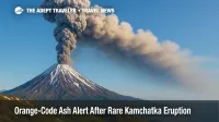 Ash plume rises above Krasheninnikov Volcano during rare Kamchatka eruption, illustrating orange aviation alert and volcanic ash hazard for flights.