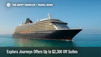 A sleek Explora Journeys ship cruises across turquoise Caribbean water under a bright sky, illustrating the new Explora Journeys promotion.