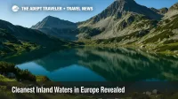 Alpine lake in Bulgaria's Pirin Mountains mirrors jagged peaks and wildflowers, illustrating Europe's cleanest inland waters report.