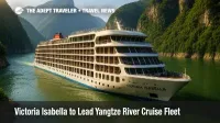 A hybrid-electric Victoria Isabella glides through the Three Gorges, showcasing balconies and sleek lines on a Yangtze River cruise.
