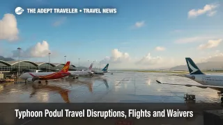 Wet ramp at Hong Kong International Airport after rain as Typhoon Podul travel disruptions ease, with parked aircraft and drying tarmac in view.