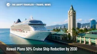 A large cruise ship docked at Honolulu Harbor near Aloha Tower under clear skies, illustrating Hawaii cruise ship reduction goals.