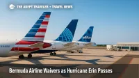 Airline tails on the ramp at L.F. Wade International Airport as Hurricane Erin prompts Bermuda airline waivers and flexible rebooking options.
