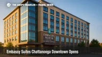 A new Chattanooga riverfront hotel, Embassy Suites Chattanooga Downtown, rises over Broad Street with glassy corners and a welcoming entrance.