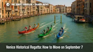A gondolini race surges up Venice's Grand Canal during the Venice Historical Regatta, with crowds lining the banks and vaporetti held clear.