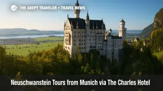 A sunlit view of Neuschwanstein above alpine forests, illustrating Neuschwanstein tours from Munich amid Bavaria's newly inscribed UNESCO palaces.