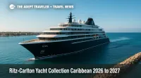 Ilma superyacht glides past a Caribbean harbor under clear skies, showcasing luxury Caribbean cruise amenities for Ritz-Carlton Yacht Collection.