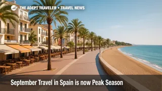 Early September evening on a Spanish beachfront promenade, showing lively cafés and calm water, illustrating September travel in Spain during shoulder season.