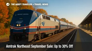 An Amtrak Northeast Regional train under clear skies pulls into a station amid early fall colors during the Amtrak Northeast September Sale.