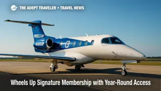 Wheels Up Phenom 300 on the ramp under clear skies, illustrating the Wheels Up Signature Membership and guaranteed private jet availability.