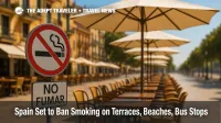 A Spanish café terrace displays a clear No Smoking sign as staff remove ashtrays, highlighting Spain's outdoor smoking ban across terraces and beaches.