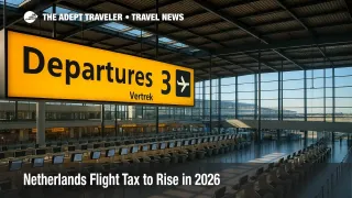 Amsterdam Schiphol departures hall with yellow wayfinding and check-in islands, illustrating Netherlands flight tax changes planned for 2026 and 2027.