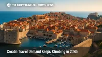 A wide elevated view of Dubrovnik's City Walls and harbor under clear skies, illustrating rising Croatia travel demand across the Adriatic coast.