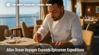 Chef plates a seasonal seafood dish in an intimate yacht dining room, illustrating the Atlas Ocean Voyages culinary program on Mediterranean cruise sailings.