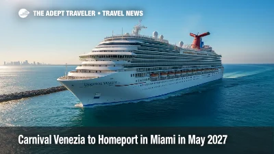 Carnival Venezia sails past PortMiami under clear skies, promoting Caribbean cruises and the line's Fun Italian Style experience for 2027-28.