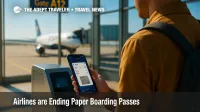 Traveler scans a phone at a gate reader, illustrating how a digital boarding pass replaces paper as airlines go app-only.