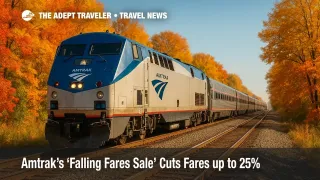 Amtrak train passing bright fall foliage during a nationwide sale, promoting discounted rail fares and Acela Business Class deals.