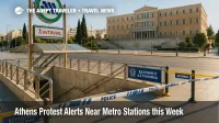 Police cordons at a Syntagma Square metro entrance in Athens during an Athens protest, with signs of brief, localized closures near central stations.