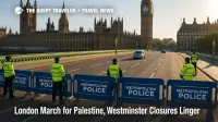 Police barriers and stewards on Westminster Bridge with light traffic, showing lingering closures after the London March for Palestine.