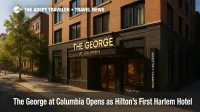 The George at Columbia, a Tapestry Collection Harlem hotel, with elegant streetscape entrance and warm lobby glow near Columbia University.