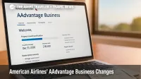 A laptop shows an AAdvantage Business dashboard while a boarding pass rests nearby, illustrating the 2026 calendar-year qualification change.