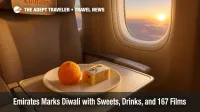 Emirates Diwali celebrations feature motichoor laddu and pista rolls on an aircraft tray table beside a window, with festive ice entertainment available.