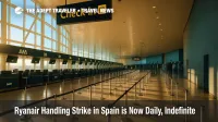 Ryanair check-in and bag drop counters in Spain during a handling strike, showing busy stanchions and counters with ground operations slowed.
