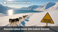 Dog-sled team crossing bright Arctic snow near Isfjorden, showcasing Basecamp Explorer 2026 Svalbard itineraries and glacier scenery.