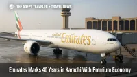 Emirates Boeing 777 at a Karachi gate with Premium Economy showcase signage, marking 40 years of Emirates service to Karachi
