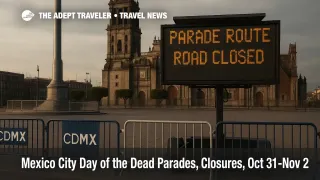 Zócalo road closure sign and barricades with the Metropolitan Cathedral in view during Day of the Dead parade route in Mexico City