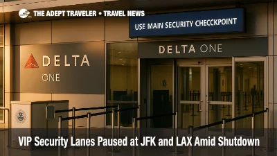Delta One check-in and security entry at JFK Terminal 4 with a sign directing passengers to the main security checkpoint during the shutdown