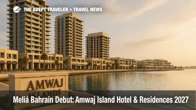 Amwaj Islands waterfront promenade with marina, towers, and entrance sign, illustrating Meliá's 2027 Bahrain debut on the upscale island setting