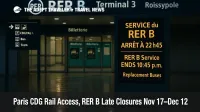 RER B entrance at Paris Charles de Gaulle with digital sign noting 10:45 p.m. service end and replacement buses, late evening wet reflections, CDG rail access warning