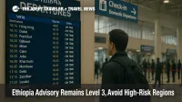 Traveler checks a departures board inside Addis Ababa Bole as Ethiopia travel advisory holds at Level 3, prompting conservative airport buffers