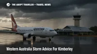 Aircraft taxiing at Broome International Airport with storm clouds and wet tarmac, illustrating Kimberley storm advice and transfer delays
